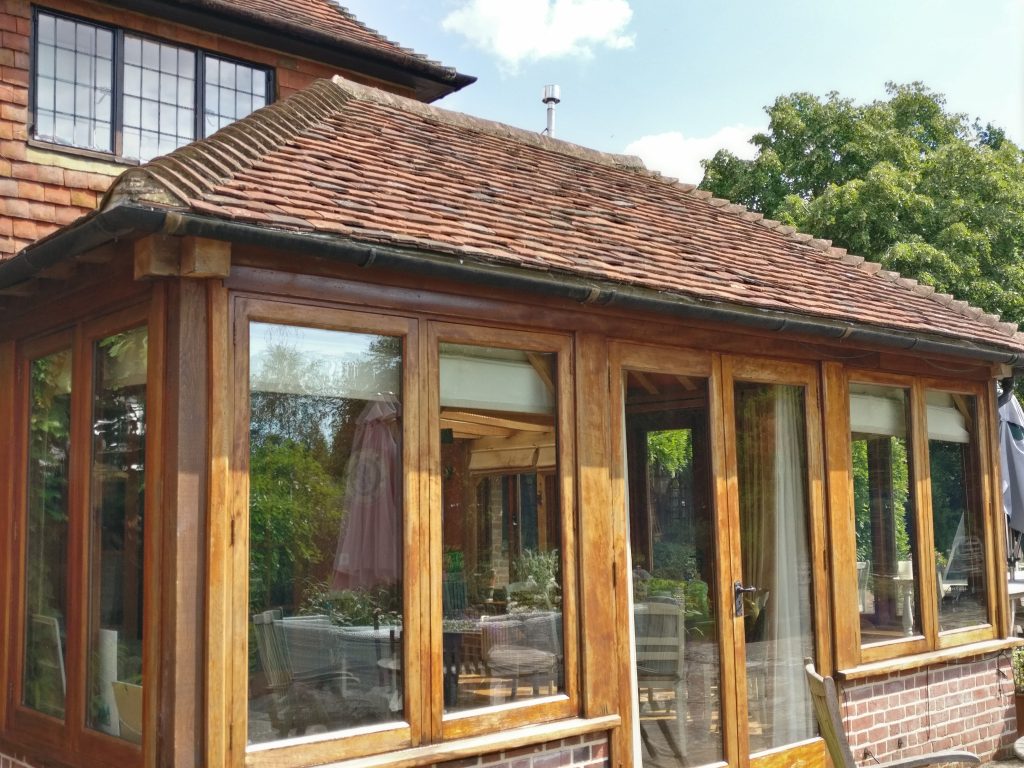 Discreet window cleaning for the Weald for perfect finish without noise or fuss. Oak framed country house orangery, cleaned by browns window cleaning.