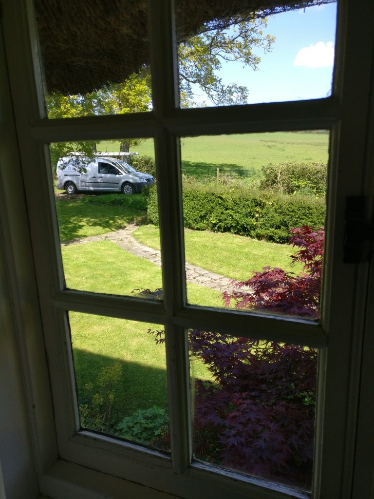 cleaning interior windows at a listed cottage in the Weald