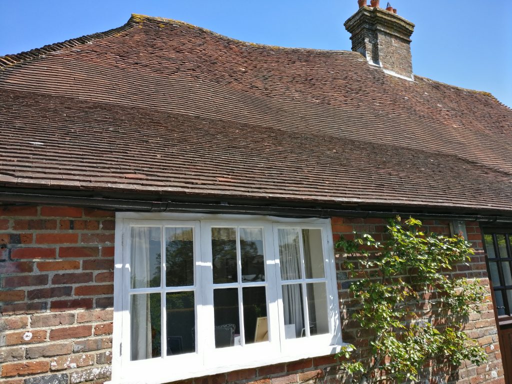 browns-cleaning.com. cleaning windows with care for clients at a charming cottage with bowed roofline character. Call us 0n 07380390757