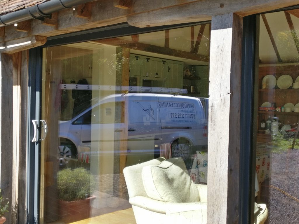browns-cleaning.com. cleaning windows for clients on a newly converted barn with bespoke windows