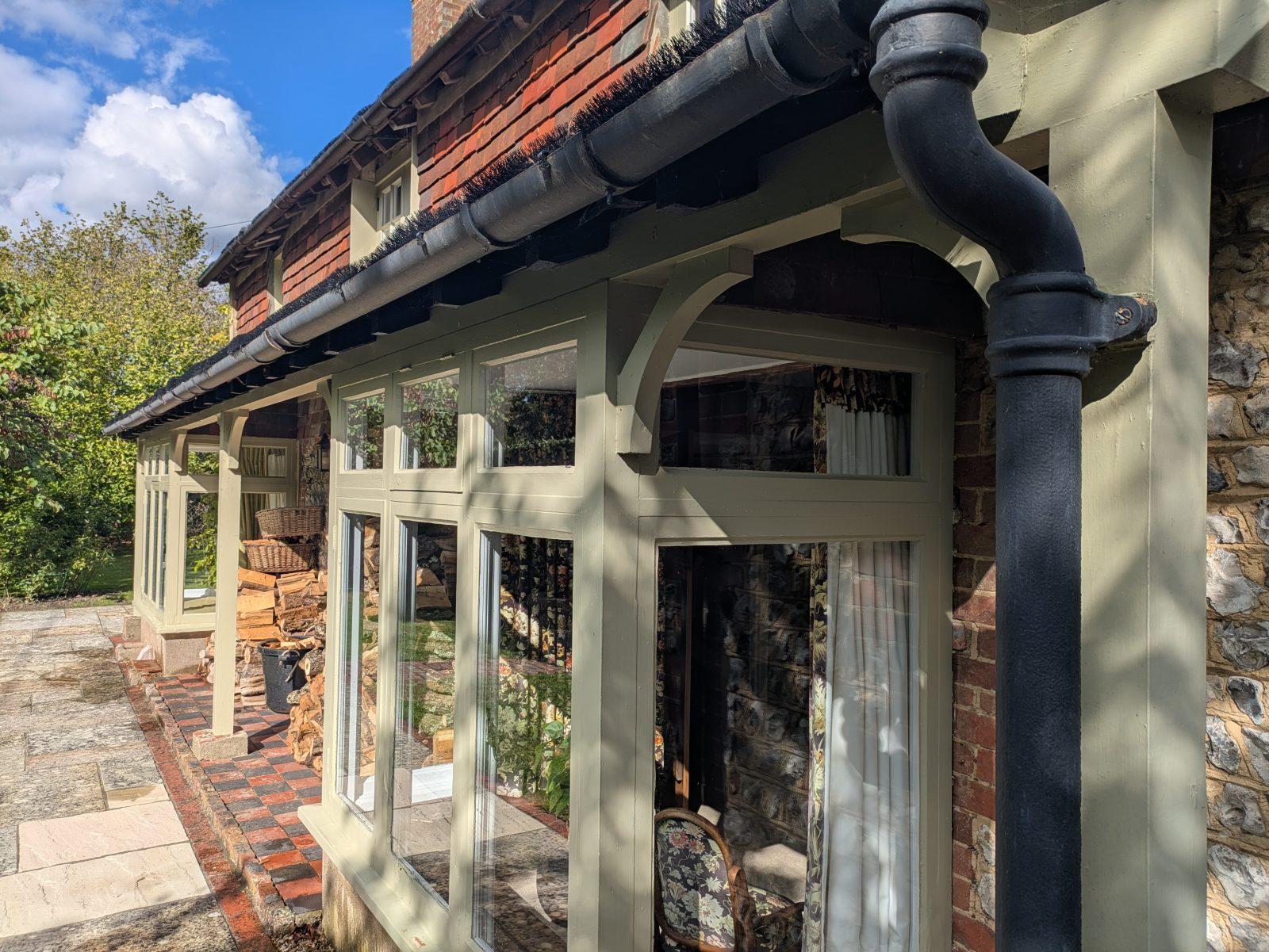Hartfield cottage wooden window frames, beautifully cleaned windows with reflections