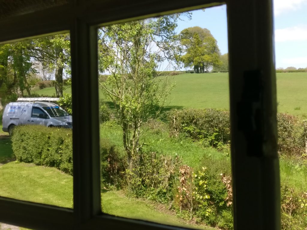 Interior Georgian window being cleaned near Burwash Common