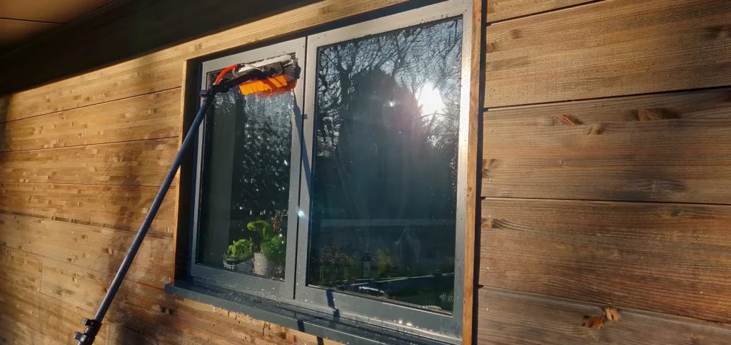 Cleaning windows at a barn conversion near Sheffield Park