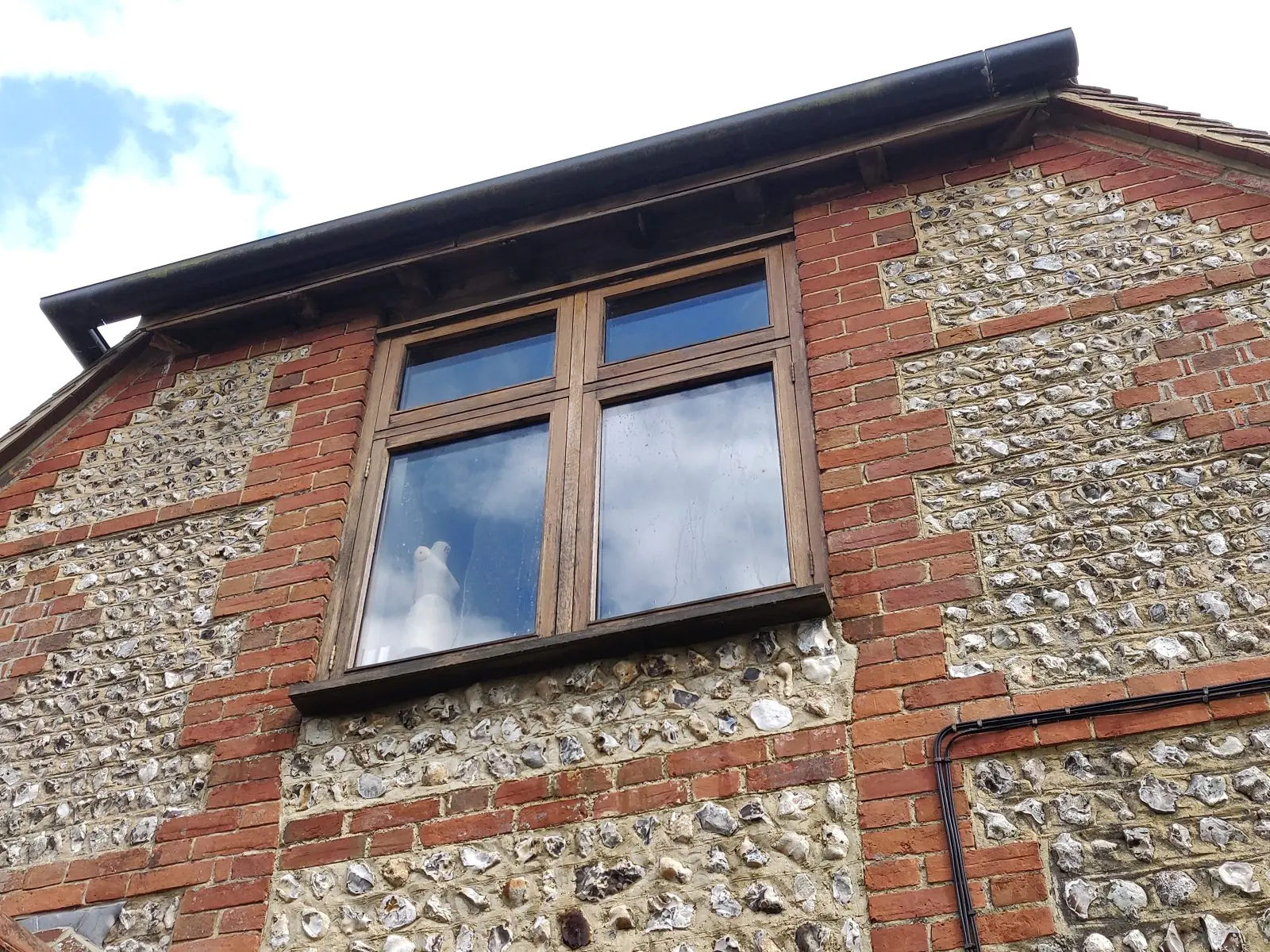 Oak-framed barn conversion with a prominent glazed gable