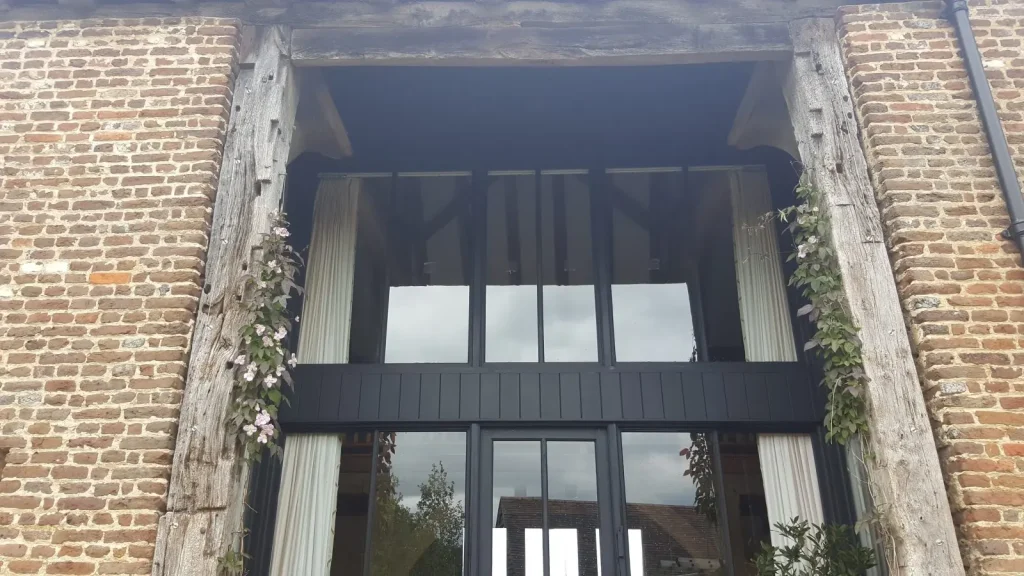 Cleaning windows at a converted barn near Wadhurst
